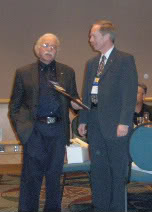 Greg Timmers presents the Mensa Copper Black 2003 award to Dr. Ringermacher